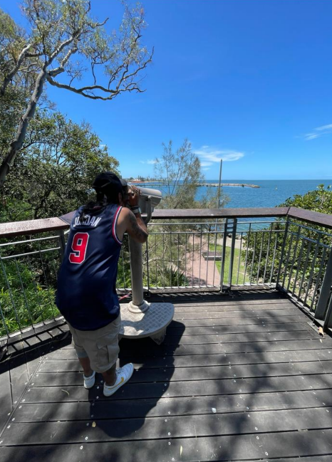 A participant looking out over the bay